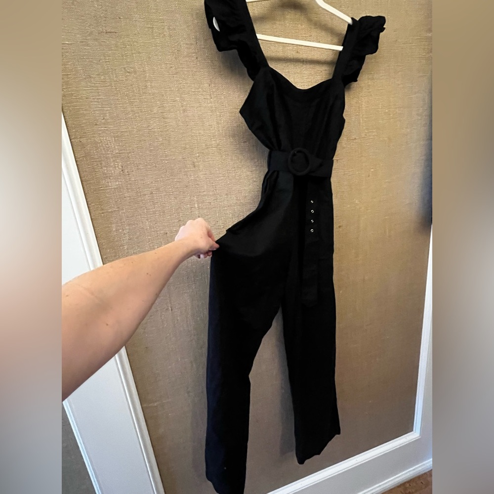 Black, belted jumpsuit with ruffle shoulders- SO CUTE!
